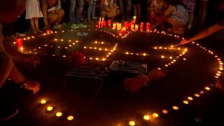 Greeks mourn wildfire victims with candlelight vigil outside parliament